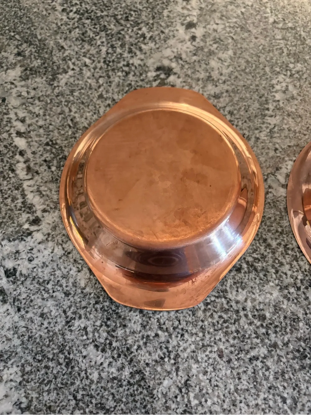 Set of two copper coated oval bowls